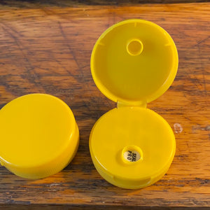 Yellow squeeze bottle caps